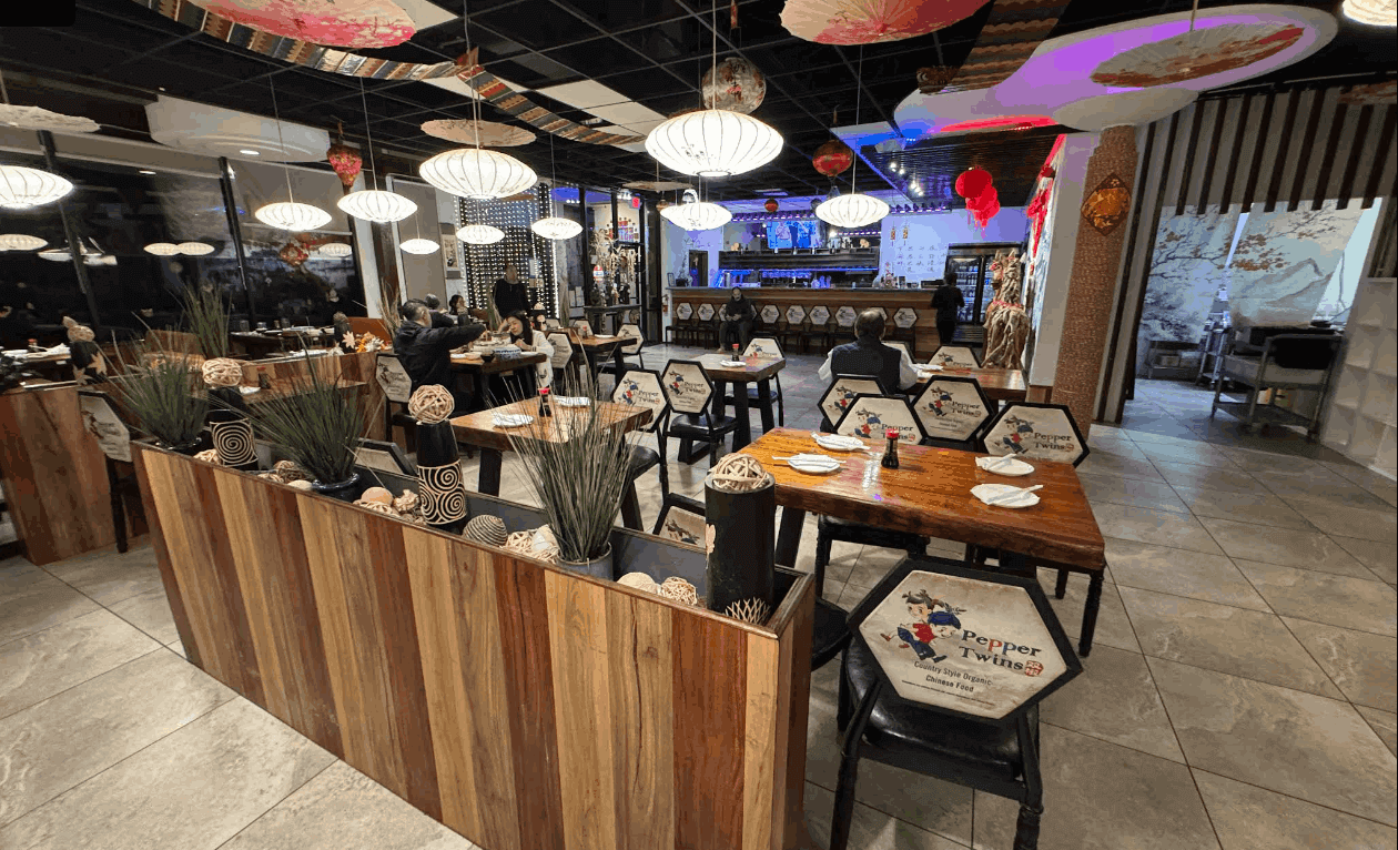 Alt Text: Homepage banner showing the Pepper Twins restaurant branding and signature Sichuan dishes.
