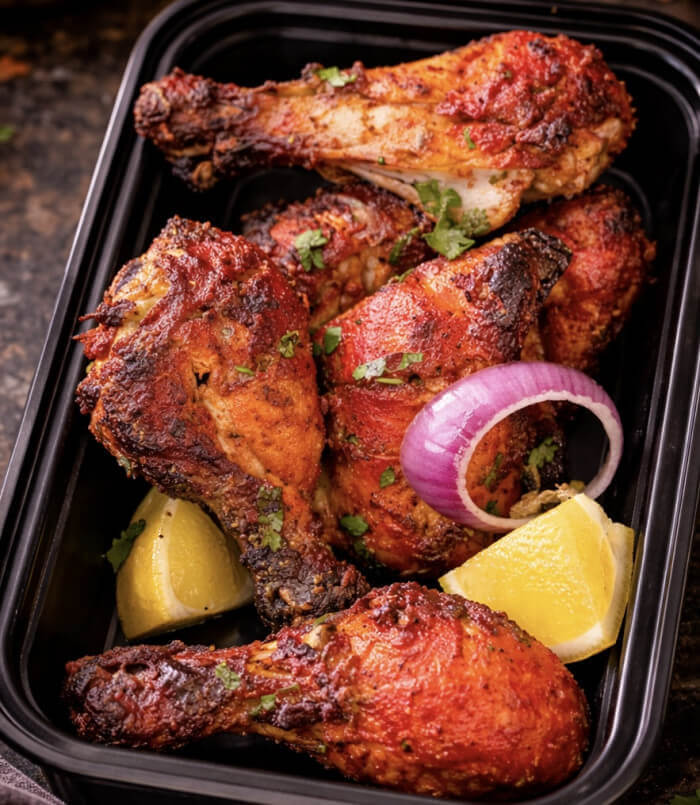 Grilled chicken tandoori marinated in yogurt and traditional spices, served with lemon wedges.