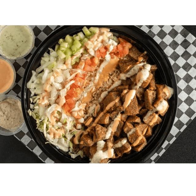 Bowl with grilled gyro chunks, rice, crisp veggies, and house sauces.