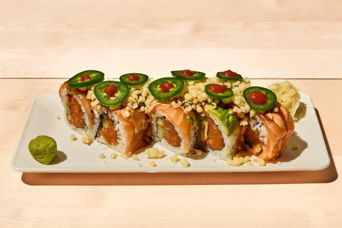 Flaming Hot Roll with spicy tuna, salmon, avocado, jalapeño, crunch, drizzled with sriracha and house special sauce.