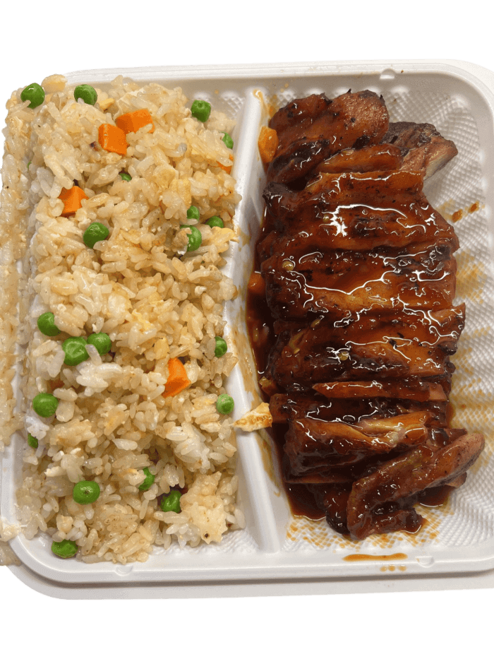 Spicy chicken and rice with chopsticks