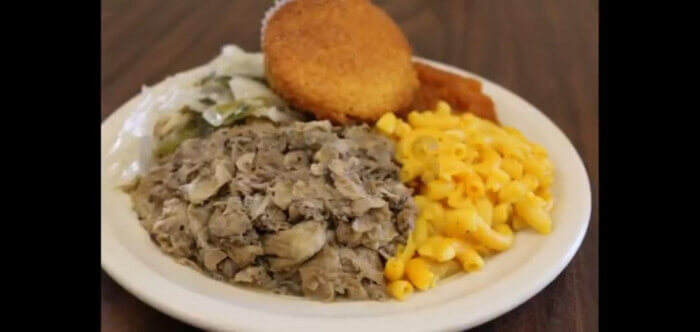 Chitterlings served with hot sauce and steamed cabbage.