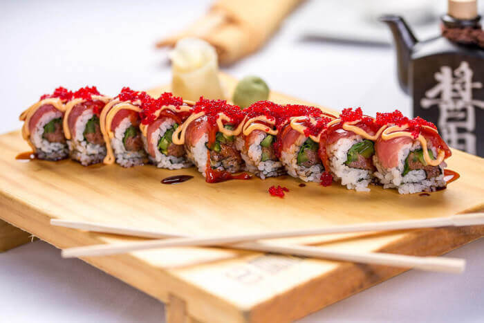 Bright red Cherry Blossom Roll with spicy tuna near Mass Ave