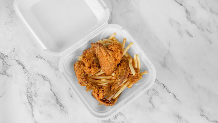 Crispy chicken wings with fries