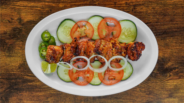 Smoky flame-grilled Chicken Tikka Boti skewers delivered in University City, Philadelphia.