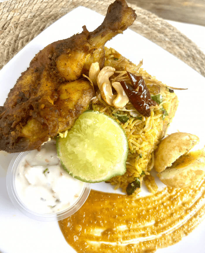 Layered goat biryani with saffron and spices