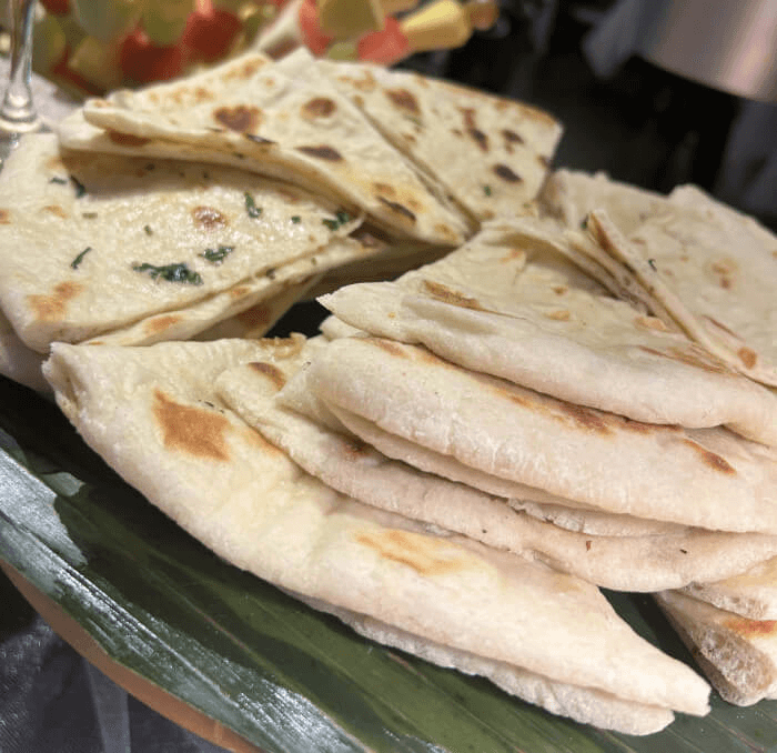 Soft garlic naan brushed with butter