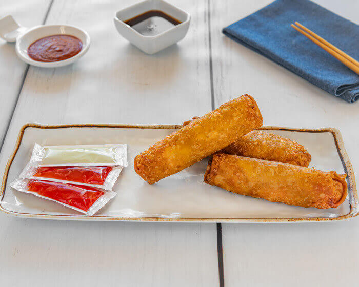Pork and veggie egg rolls, golden fried and served in threes