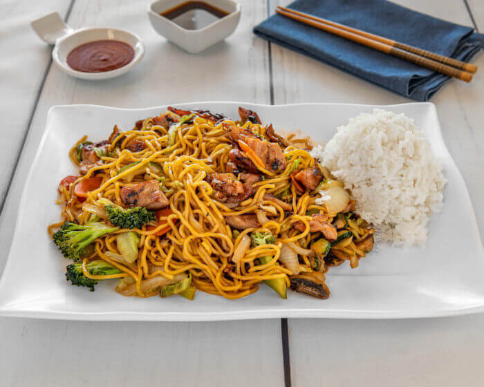 Stir-fried Chicken Yakisoba noodles with fresh vegetables and white rice at Manna Teriyaki Lowell