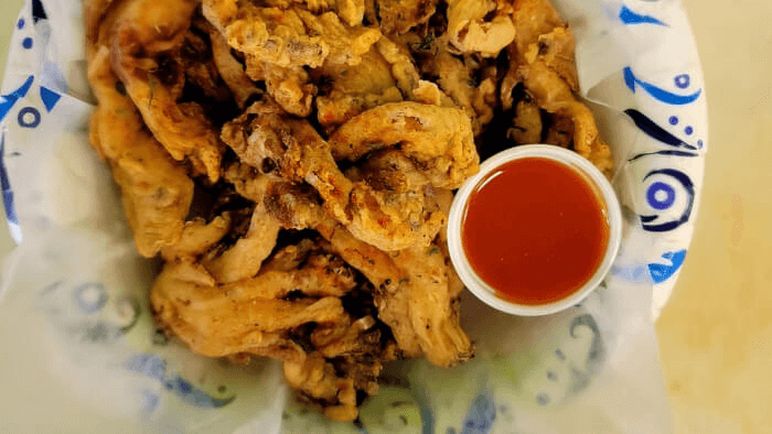 Crispy oyster mushroom bites served with crunchy kale slaw.
